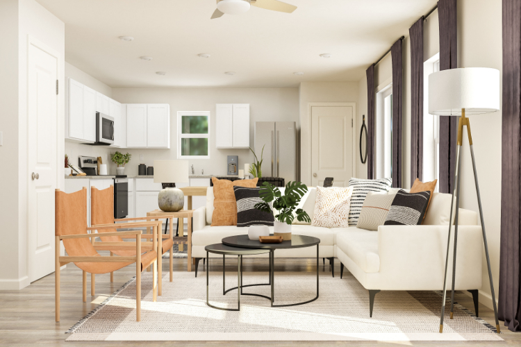 A living room with a white couch and a table.