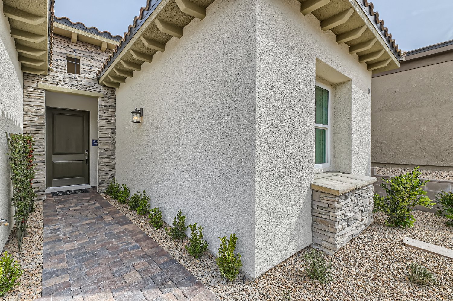 A stone building with a stone patio.
