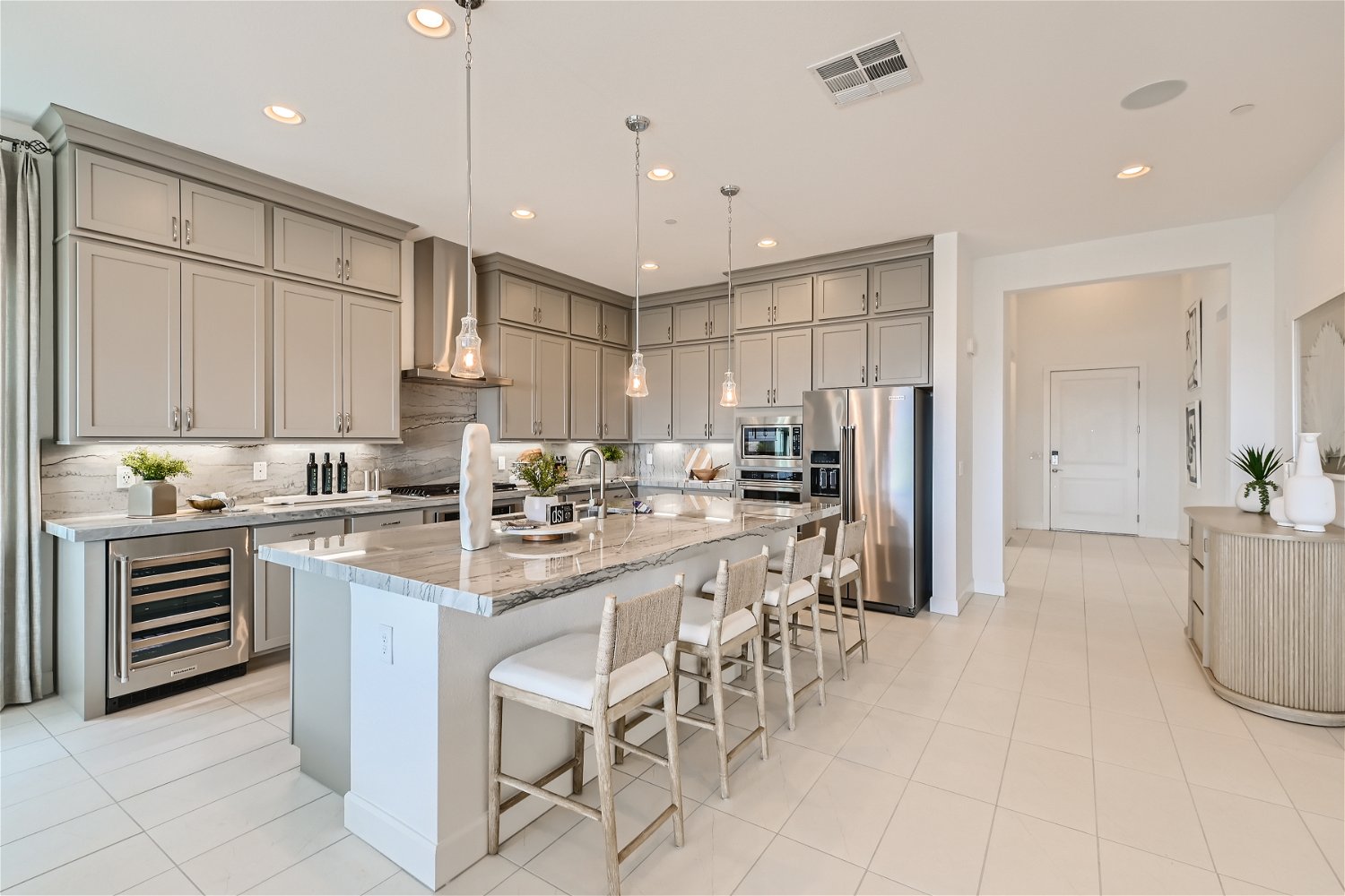 A kitchen with a marble island.
