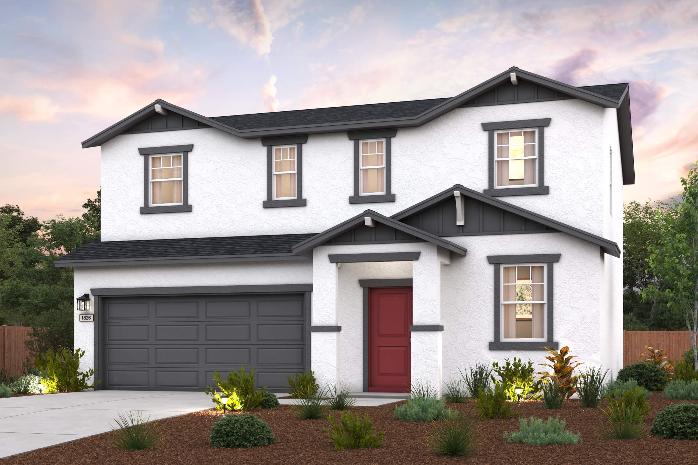 A white house with a garage.