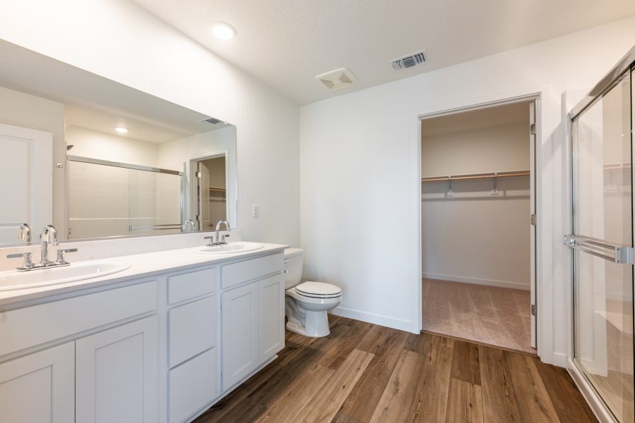 A bathroom with a toilet and sink.