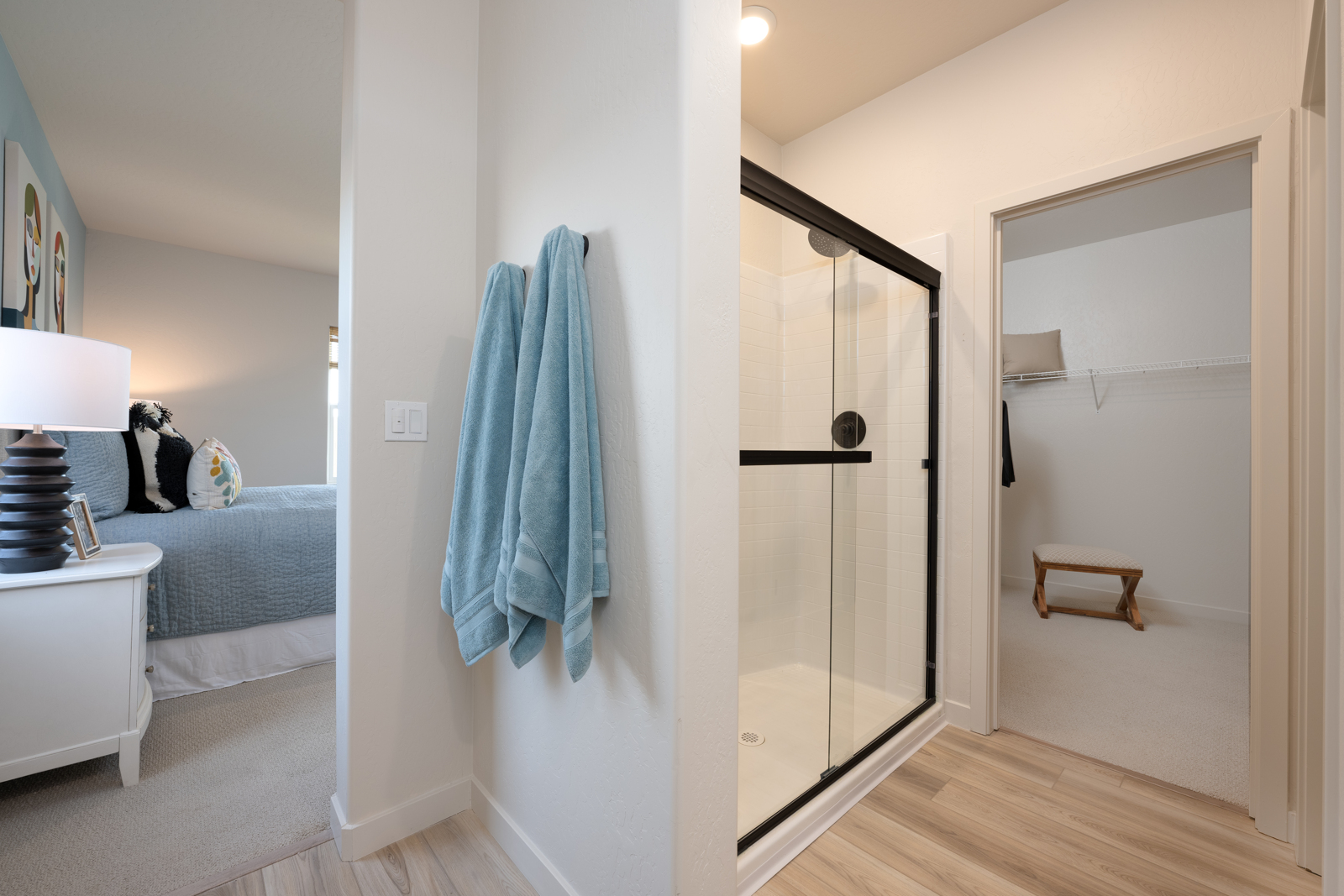 A bathroom with a glass door.