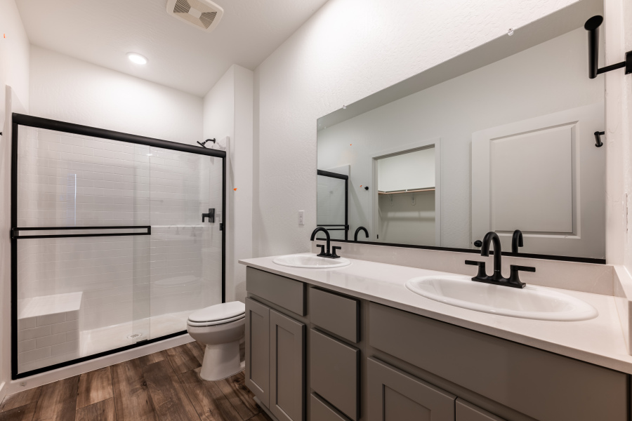 A bathroom with a sink and a toilet.