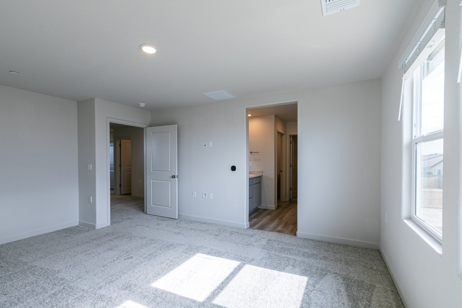 A room with white walls and a tile floor.
