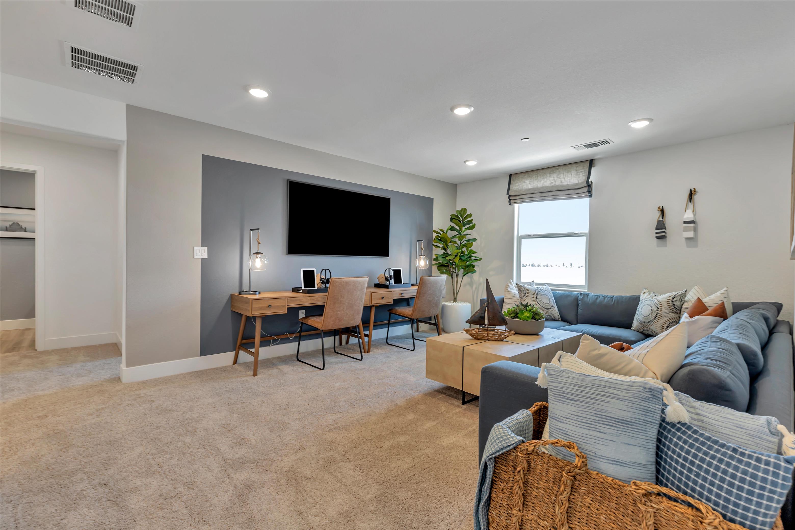 A living room with a tv and couches.