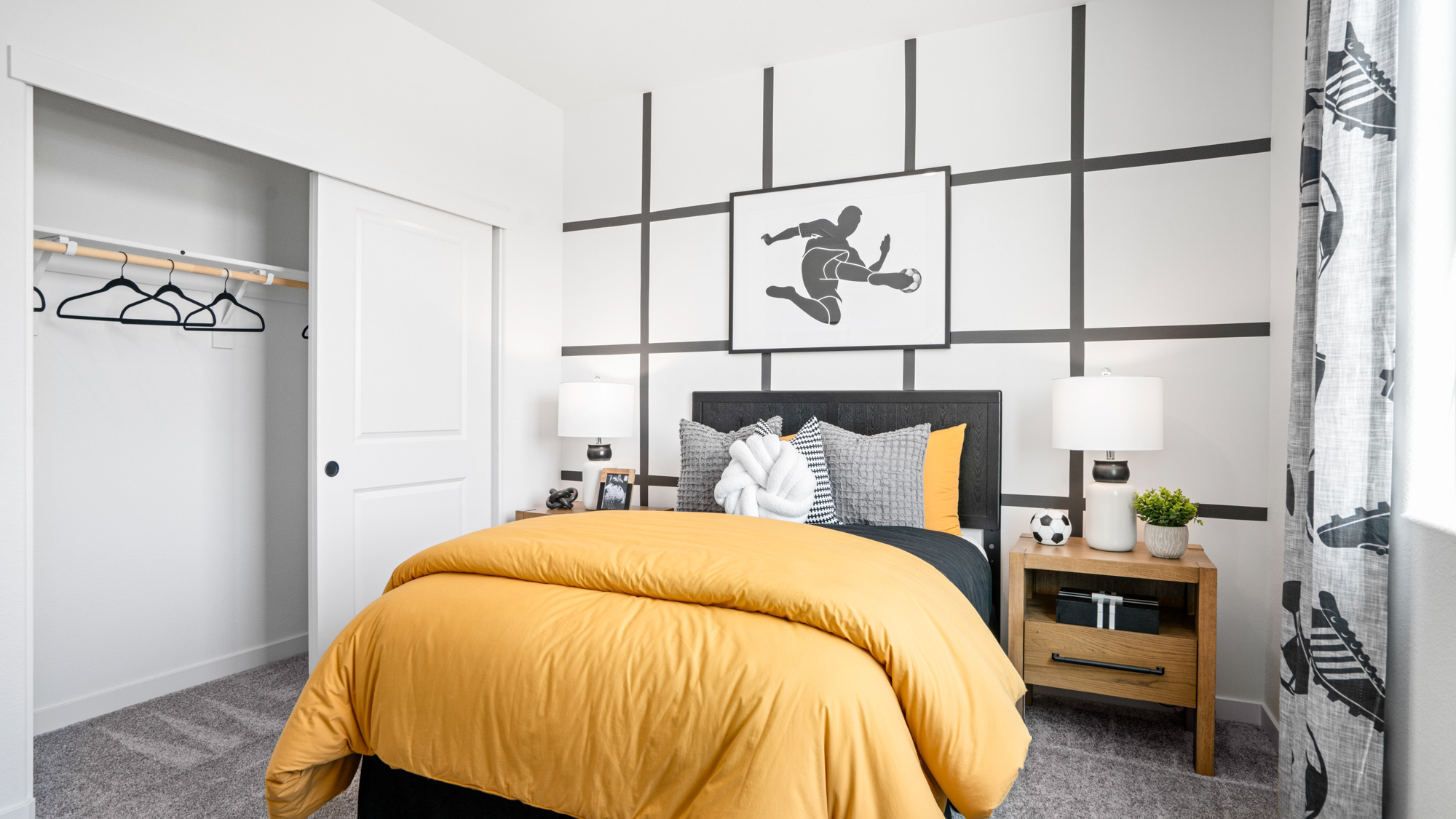 A bedroom with a bed and lamps.