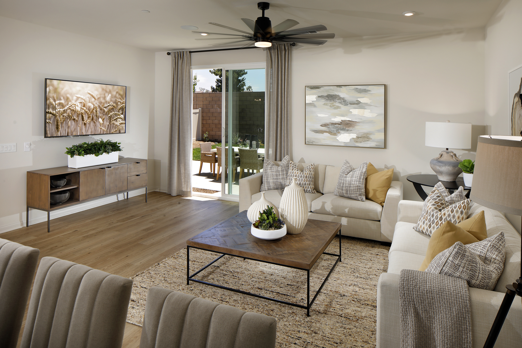 A living room with a large glass door.