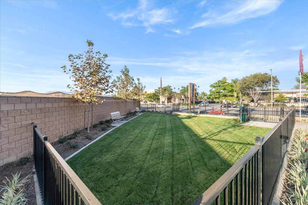 A fenced in grass field.