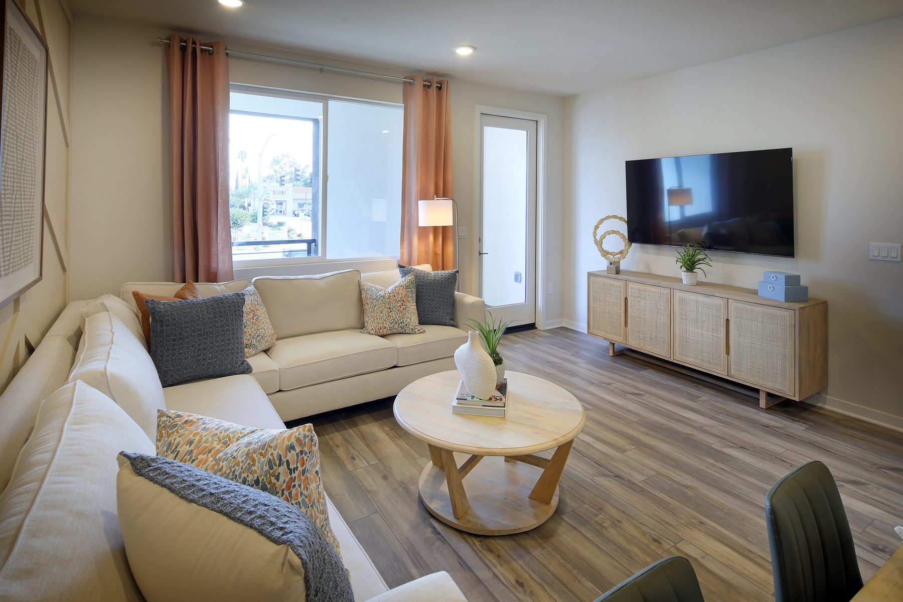 A living room with a tv and couches.