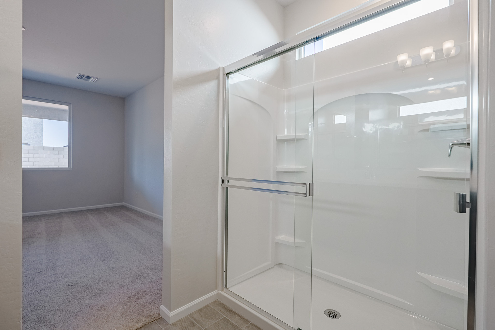 A bathroom with a glass shower.