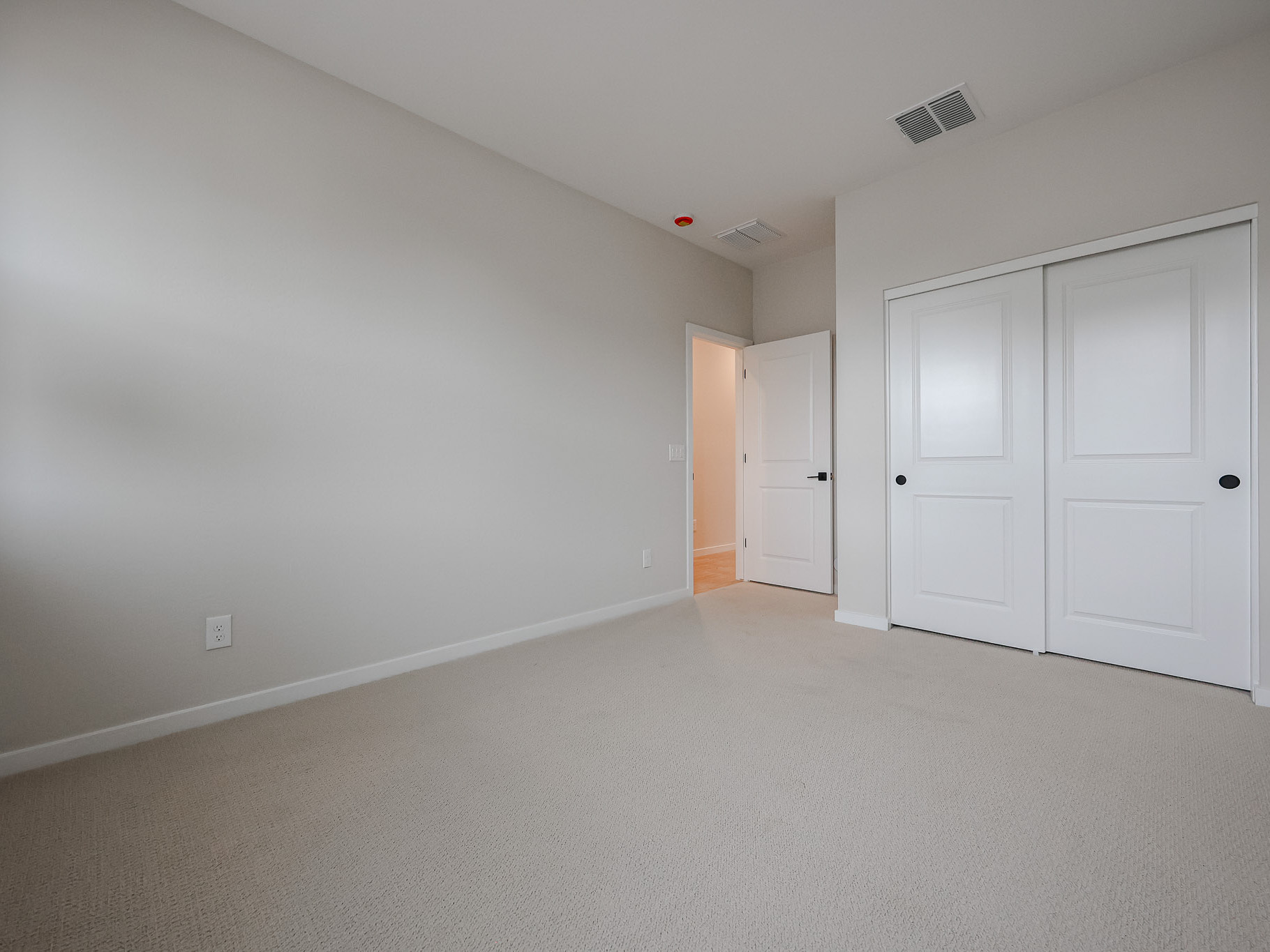 A room with white doors.