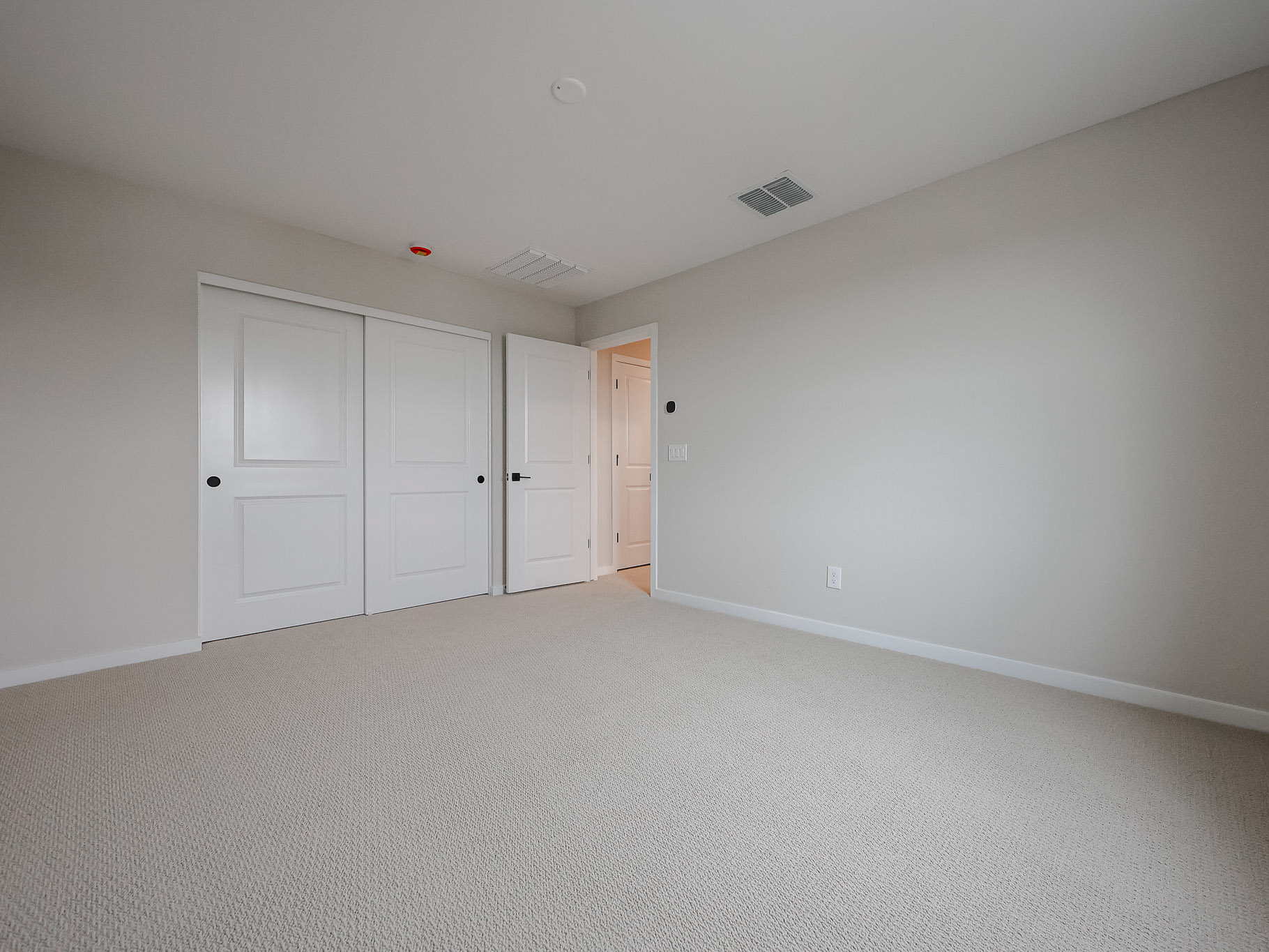 A room with white doors.