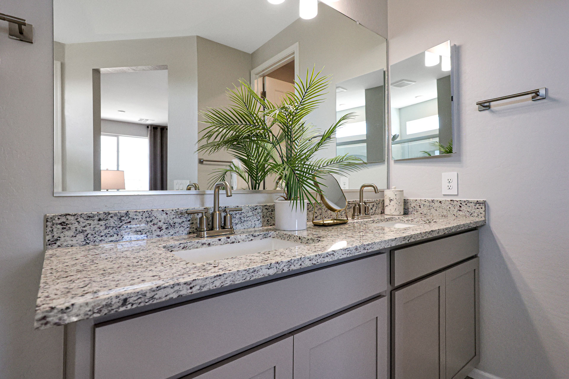 A bathroom with a marble countertop.