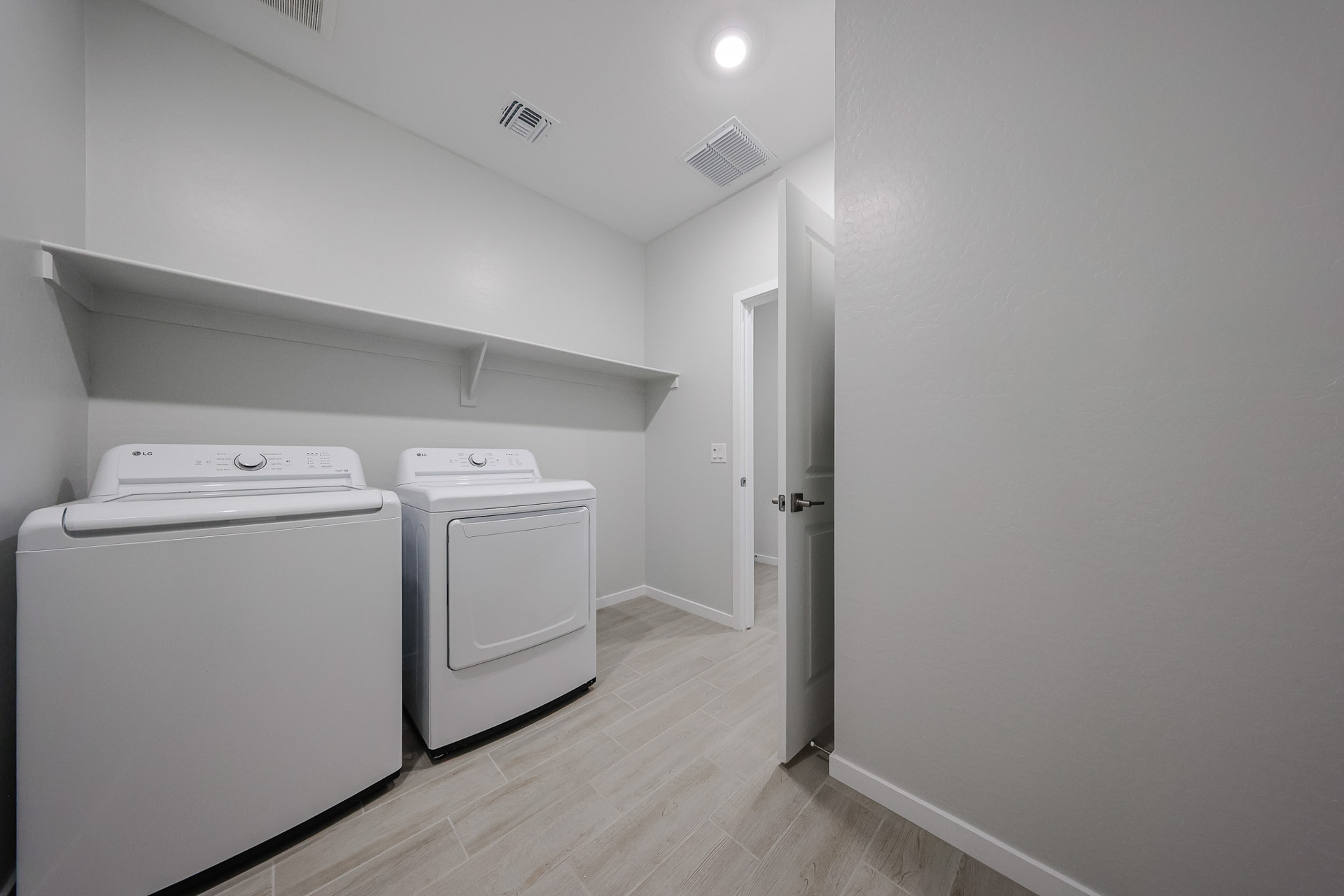 A room with white appliances.