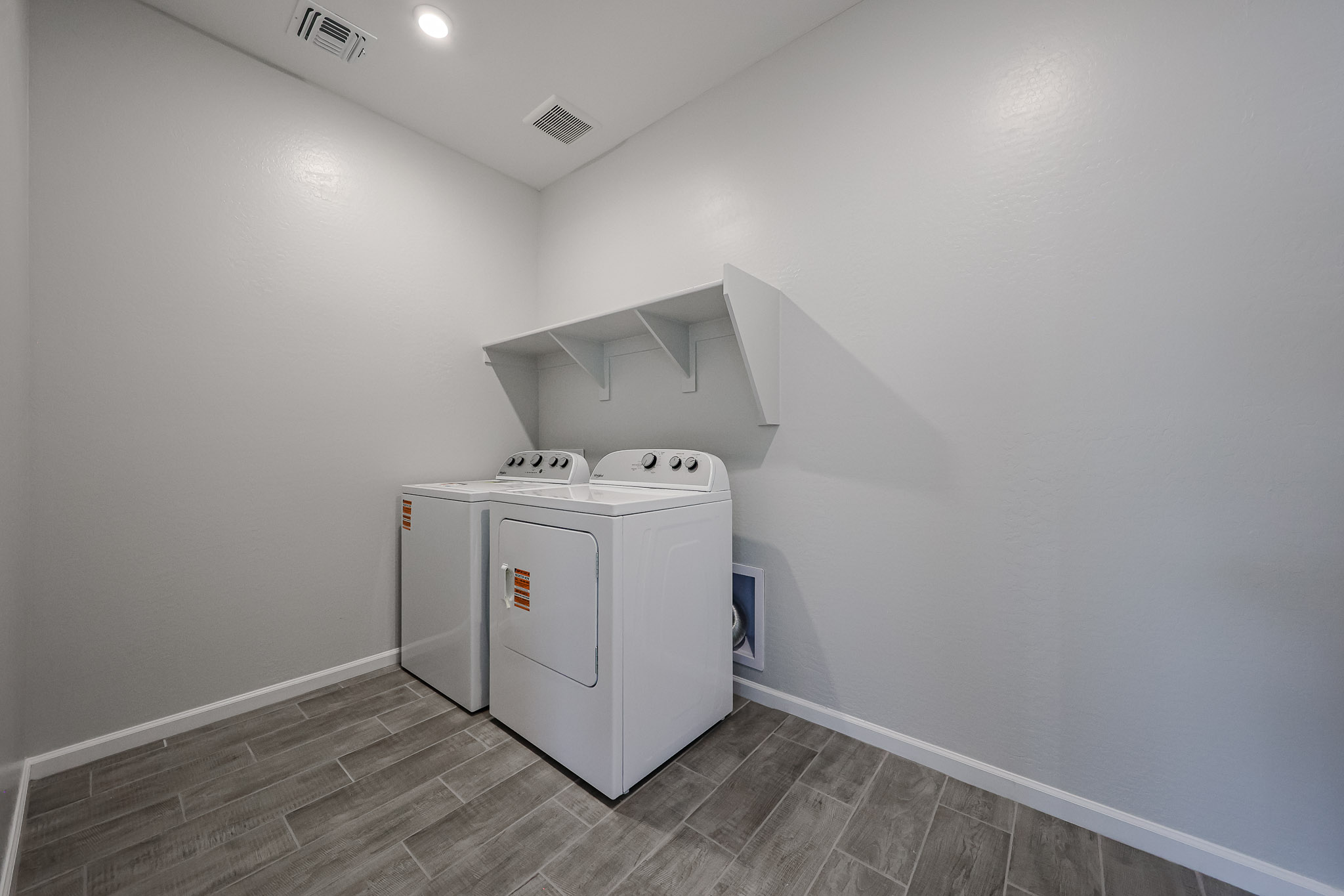 A white machine in a room.