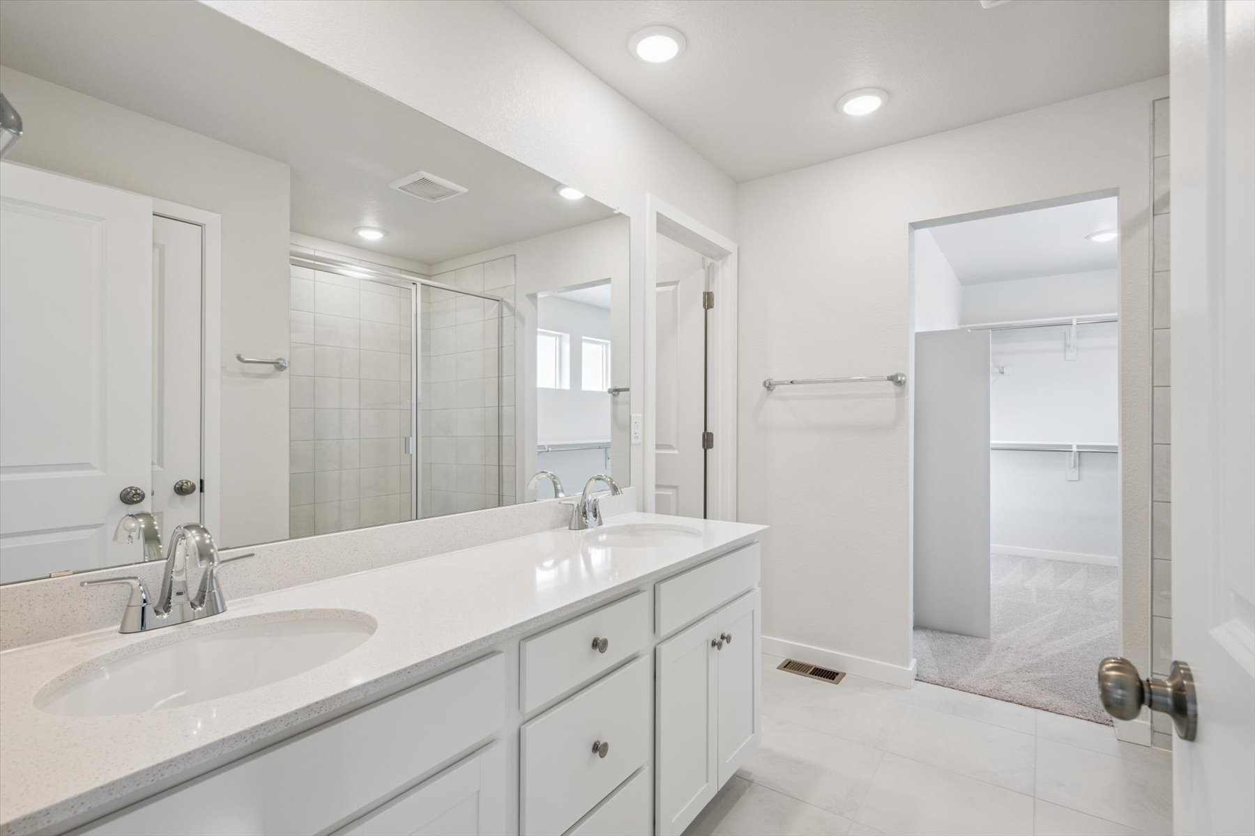 A bathroom with a glass shower.