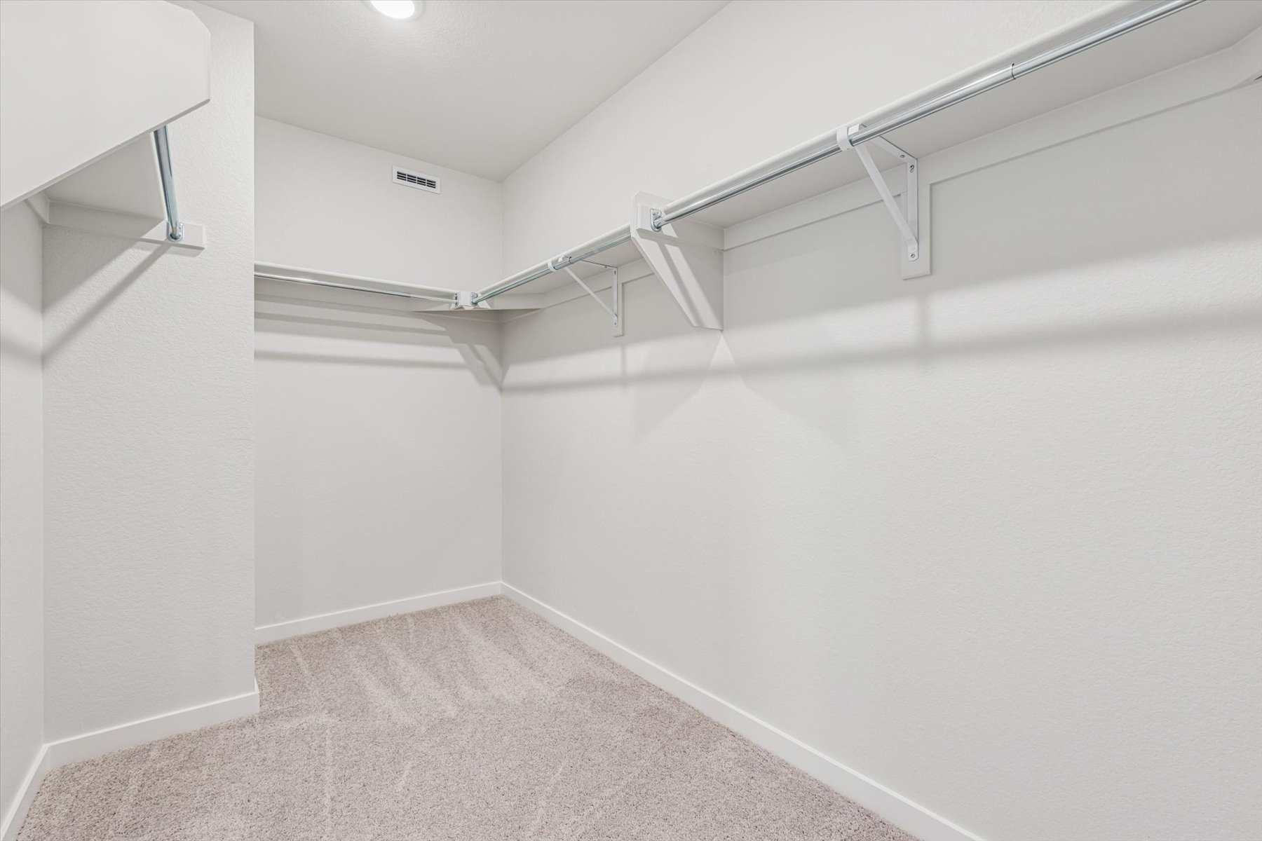A white staircase in a room.