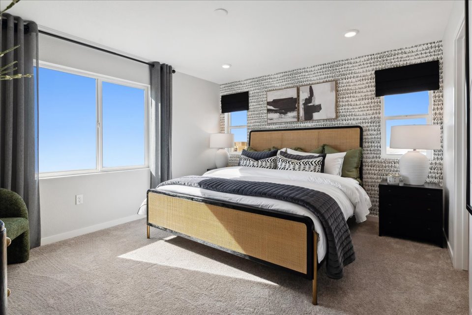 A bedroom with a large bed.