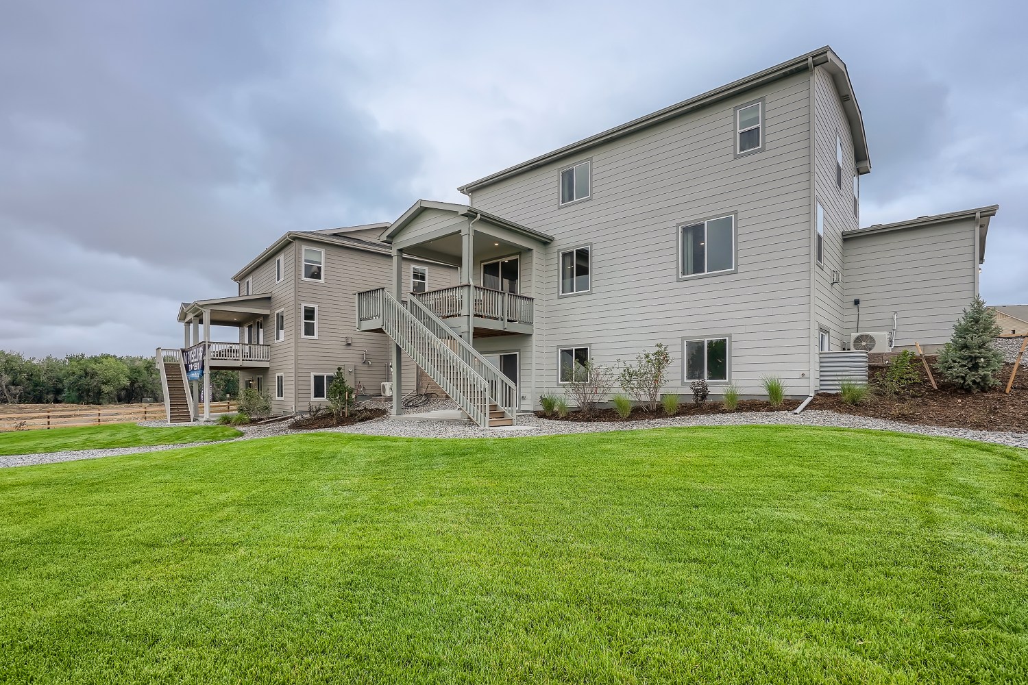 A house with a lawn in front of it.