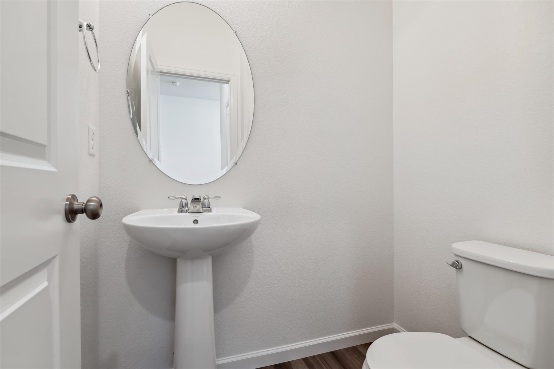 A bathroom with a sink and toilet.