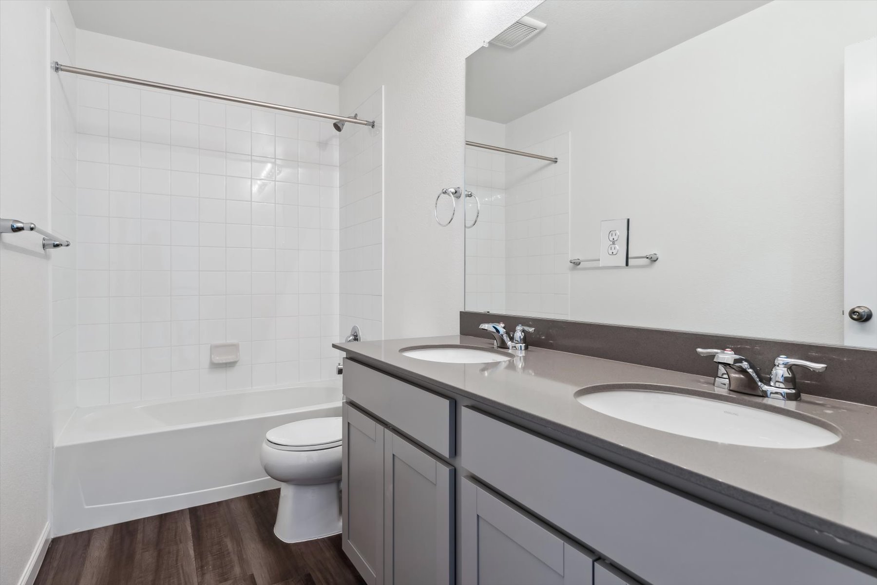 A bathroom with a sink toilet and shower.