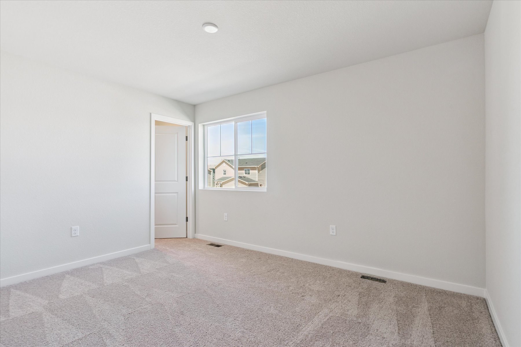 A room with a door and a window.