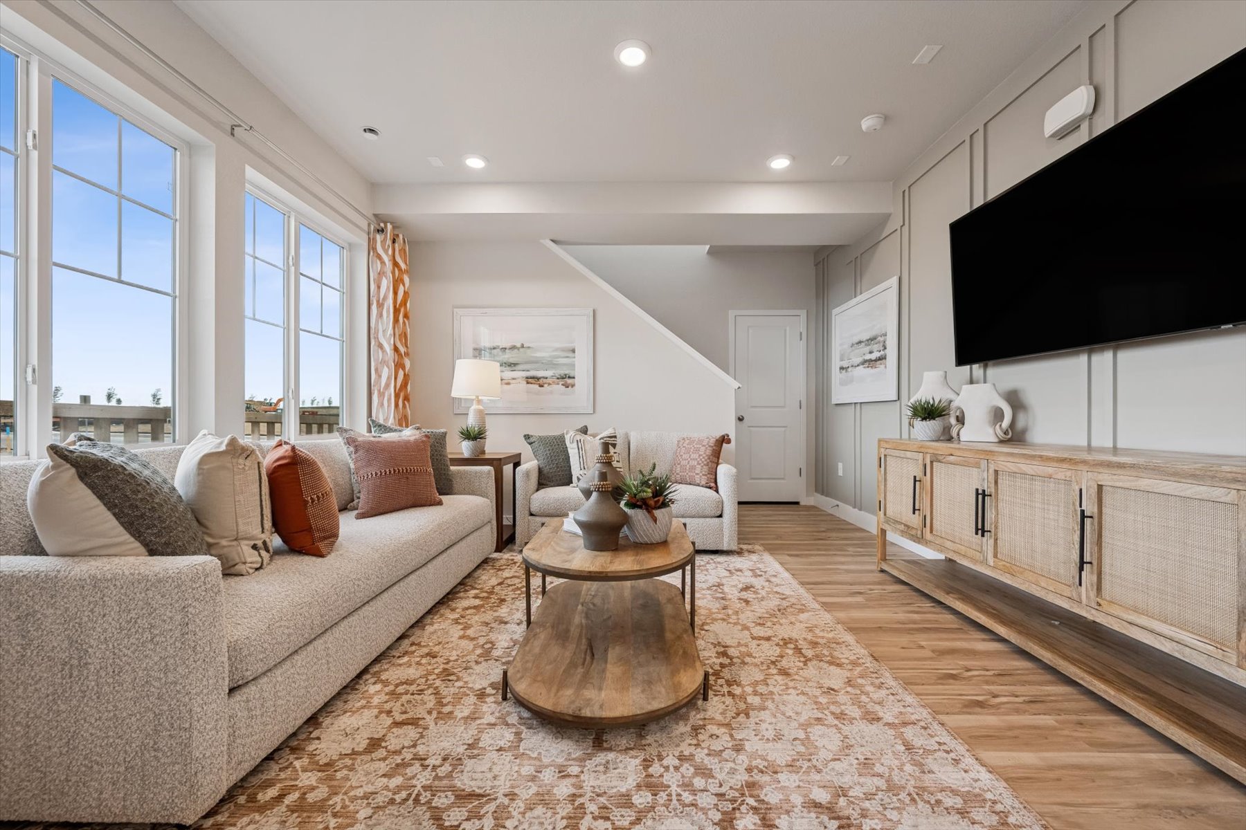 A living room with a large tv.