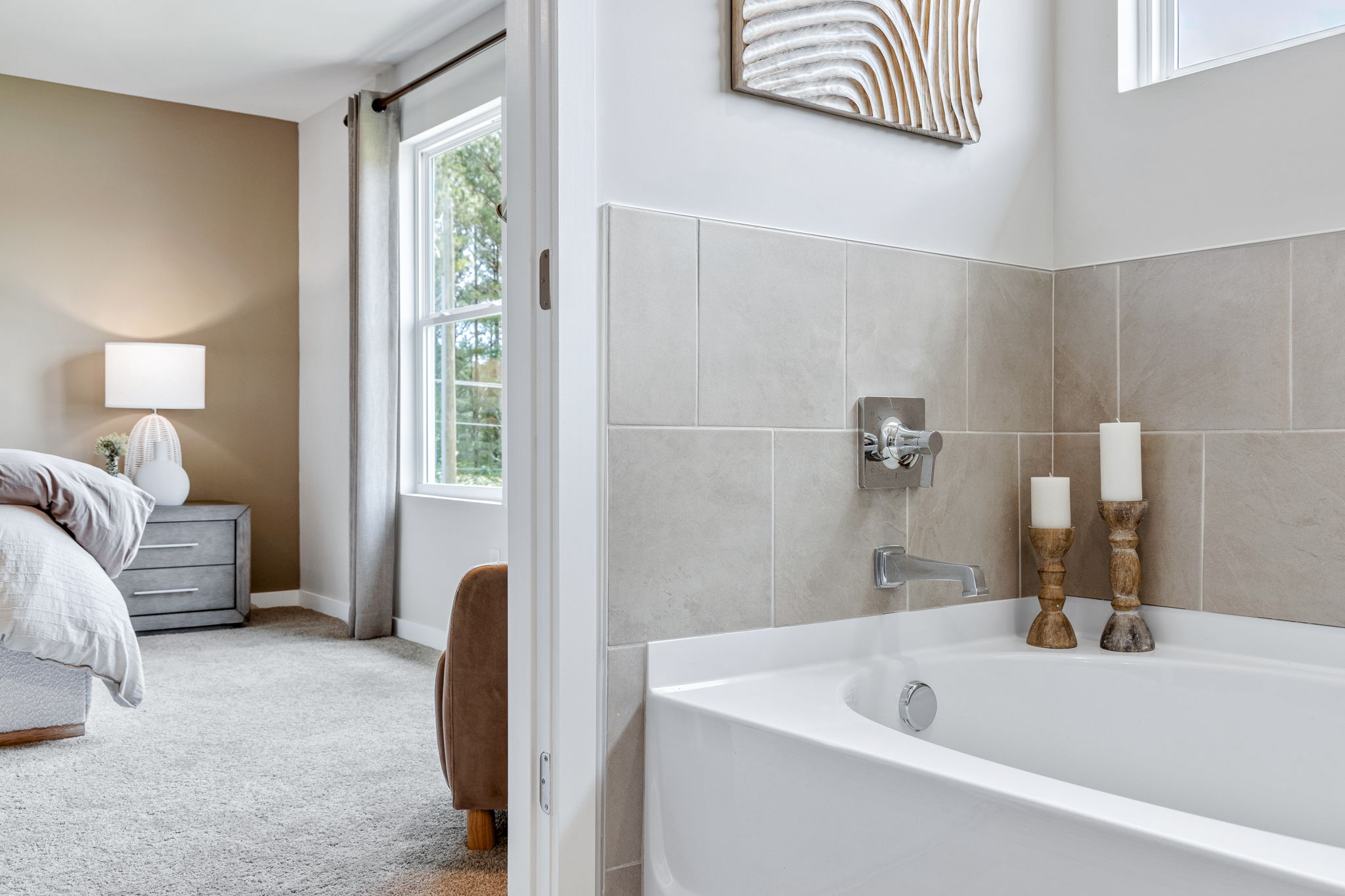 A bathroom with a tub and a sink.