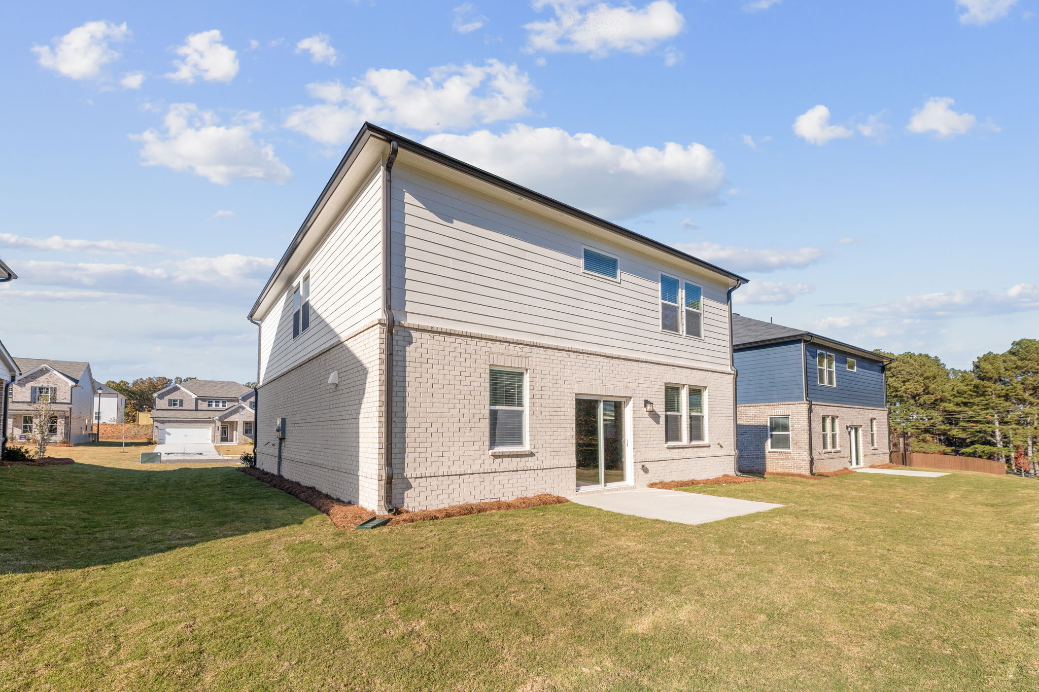 A house with a grass yard.