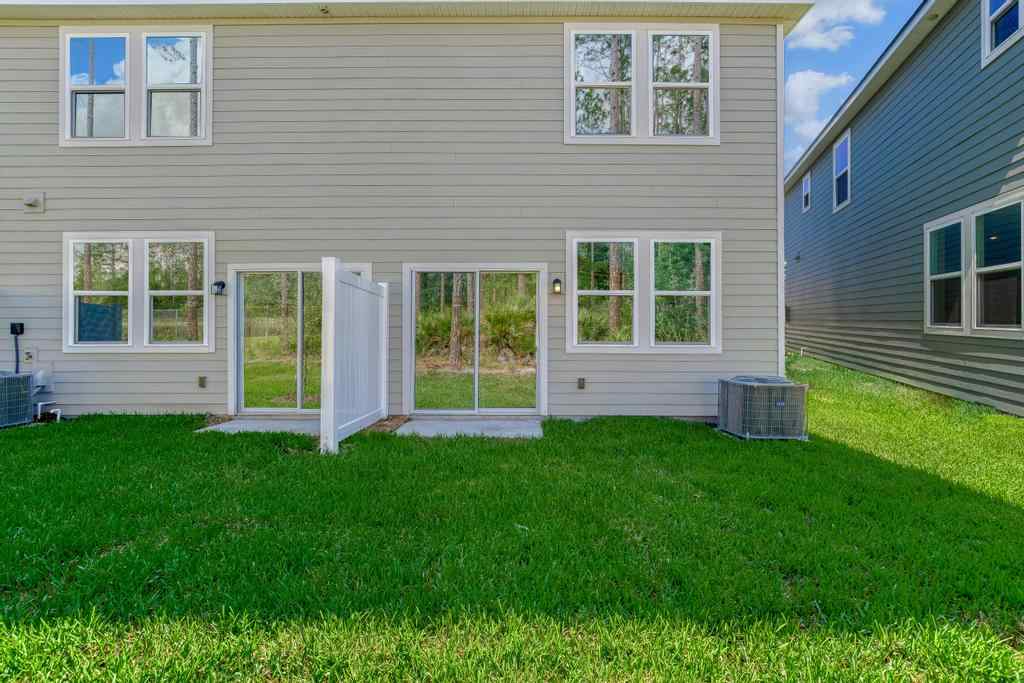 A house with a lawn in front of it.