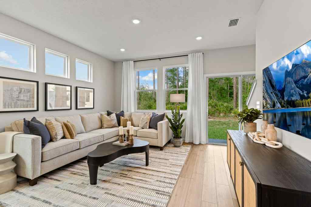 A living room with a large window.