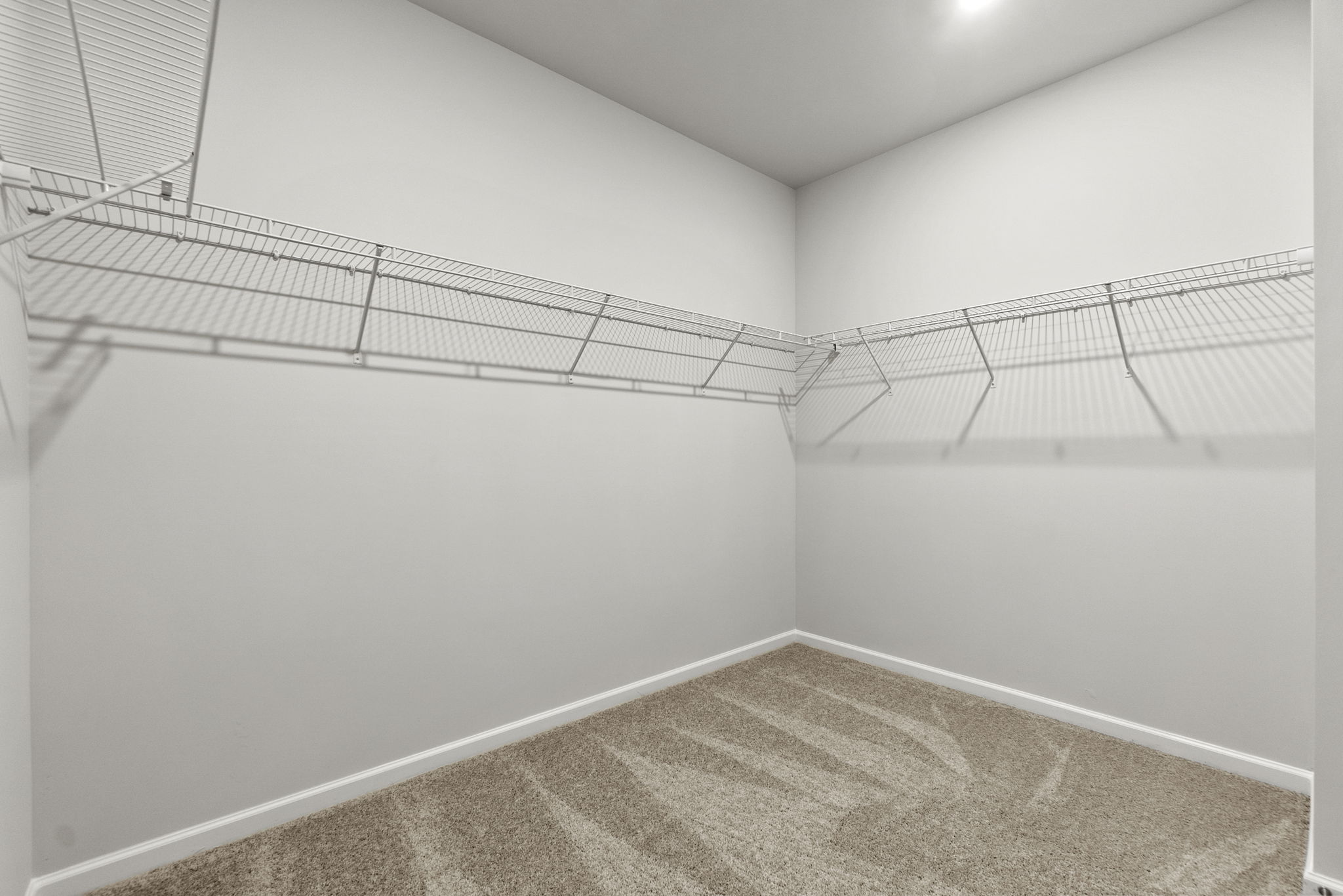 A white room with a tile floor.