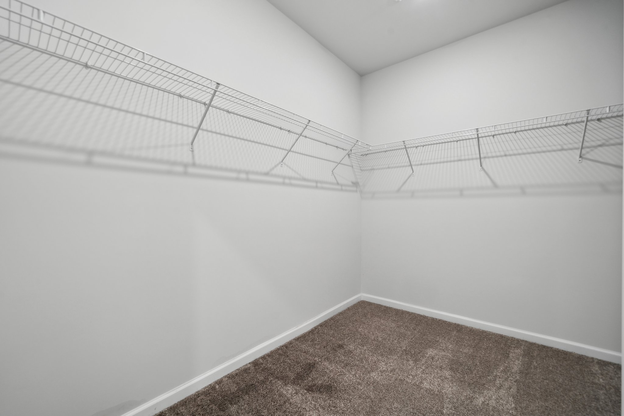 A hallway with white walls.