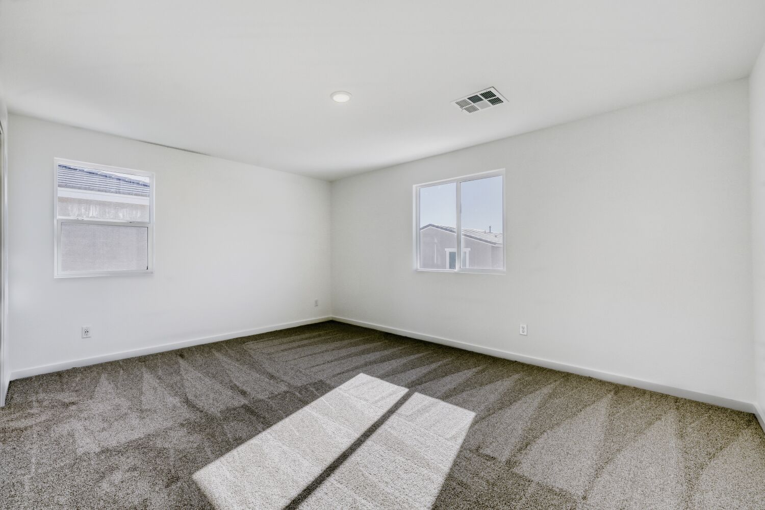 A room with a tile floor and a window.