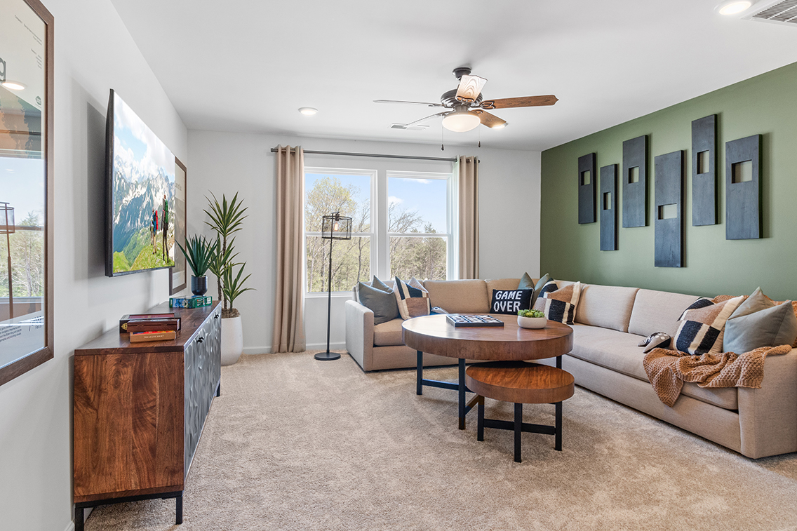 A living room with a couch and a table.