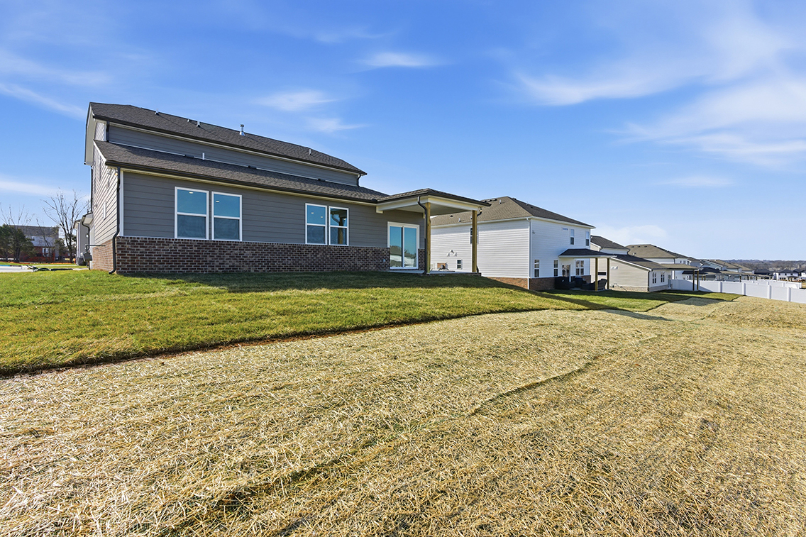 A house with a grass yard.