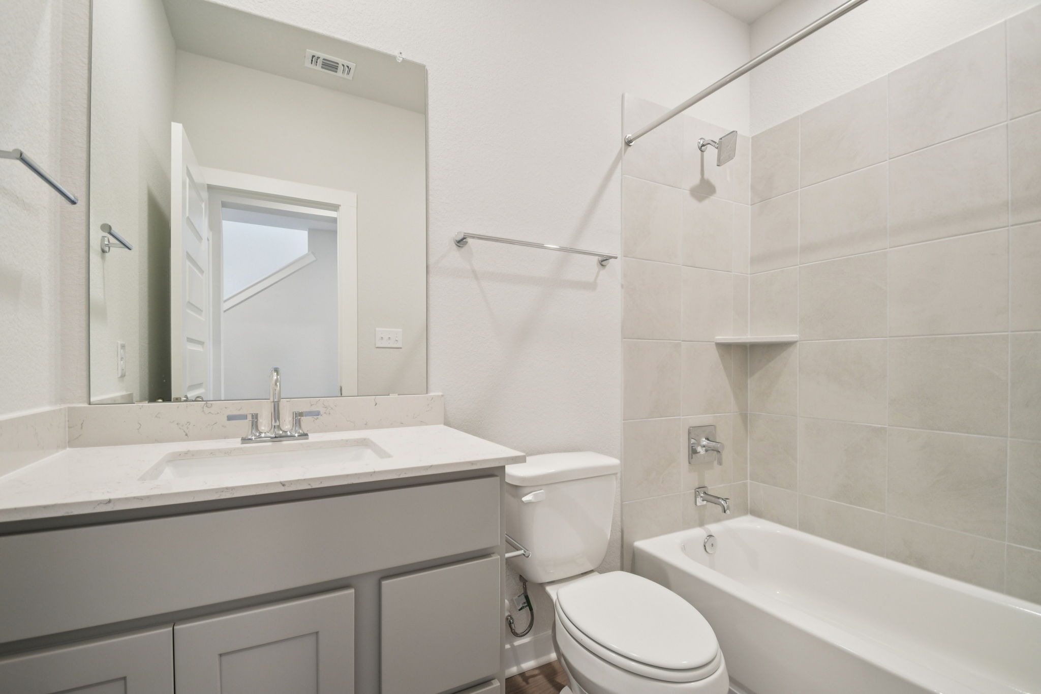 A bathroom with a toilet and sink.