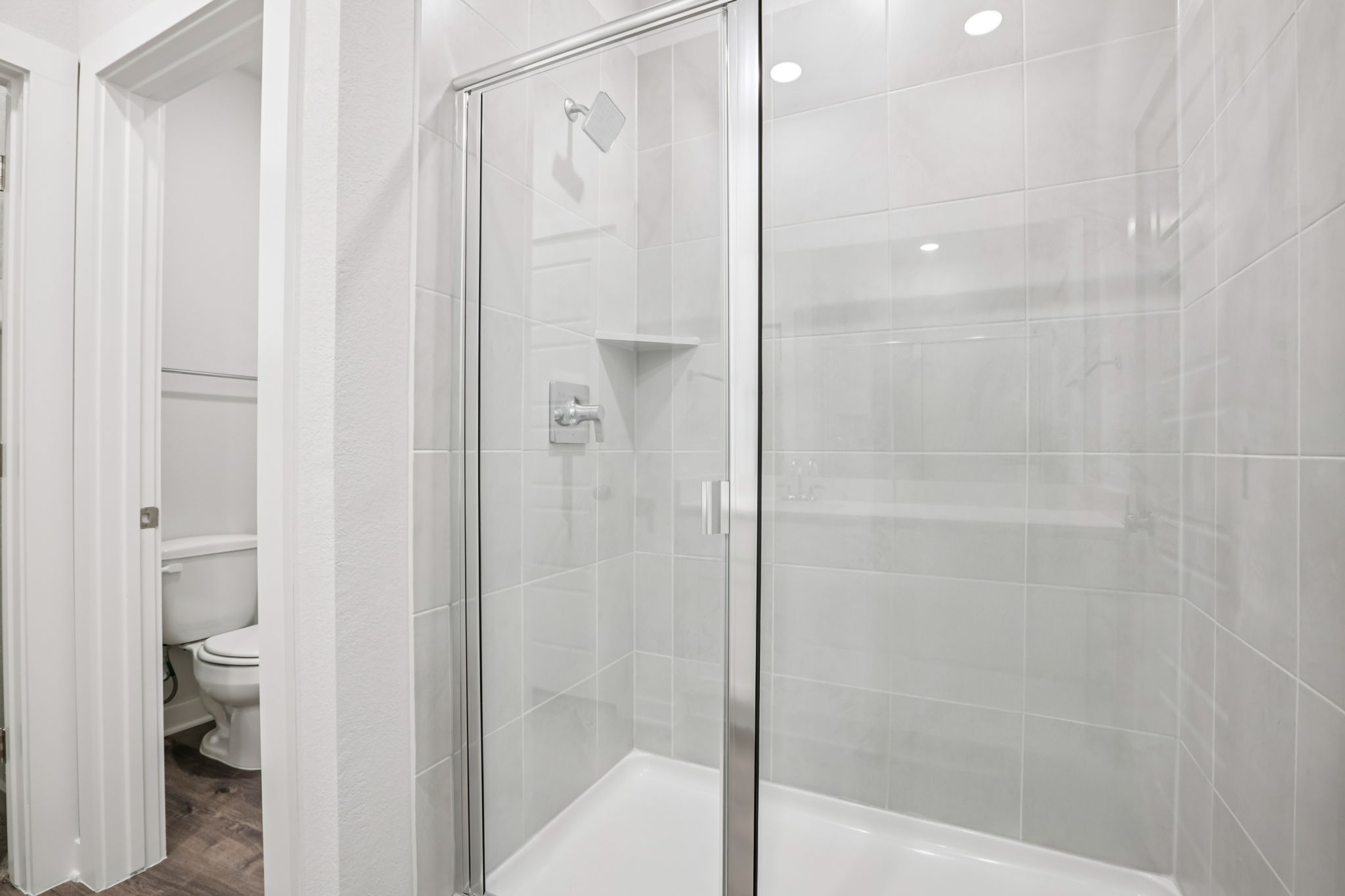 A bathroom with a glass shower.