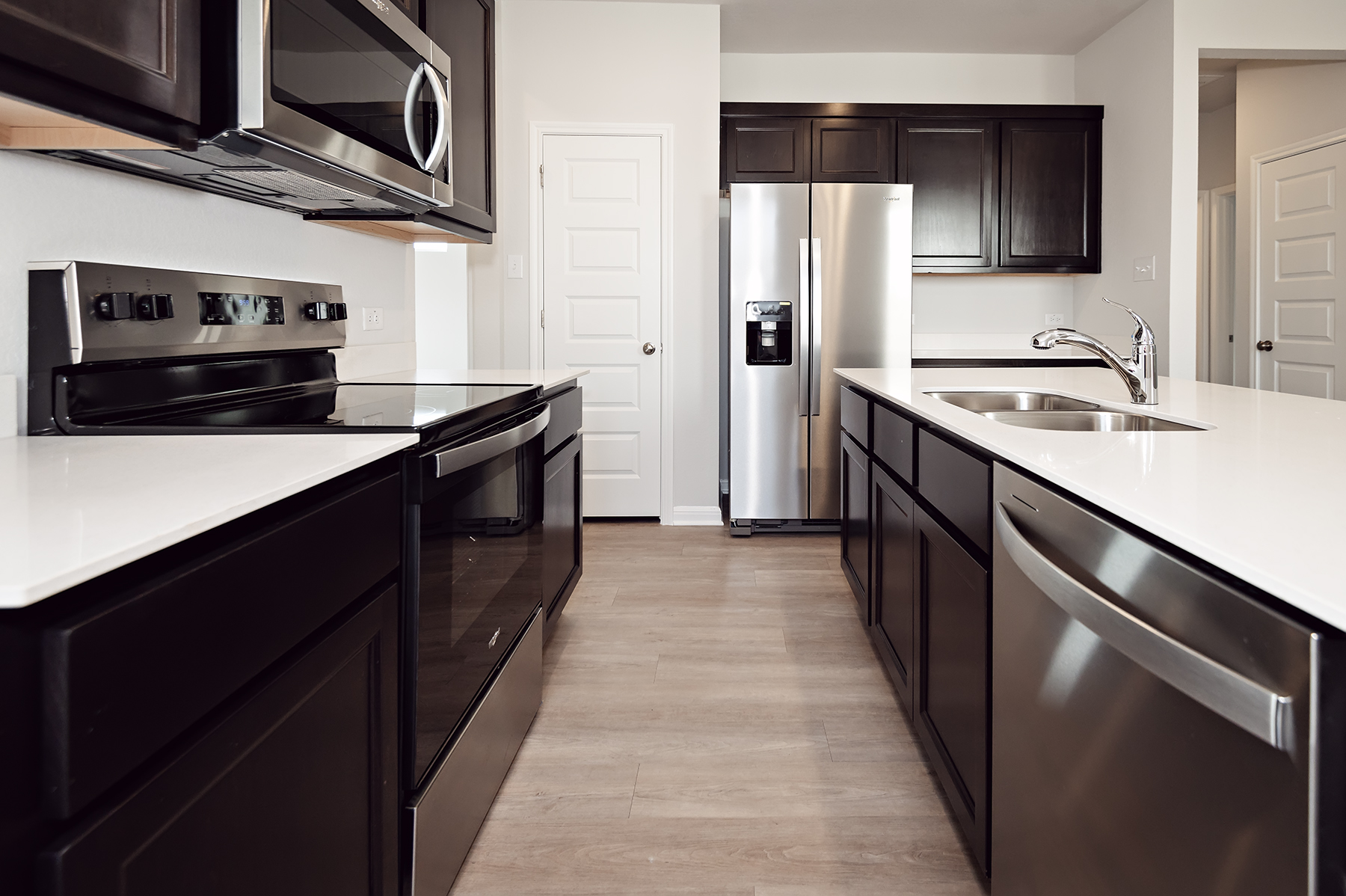 A kitchen with black appliances.