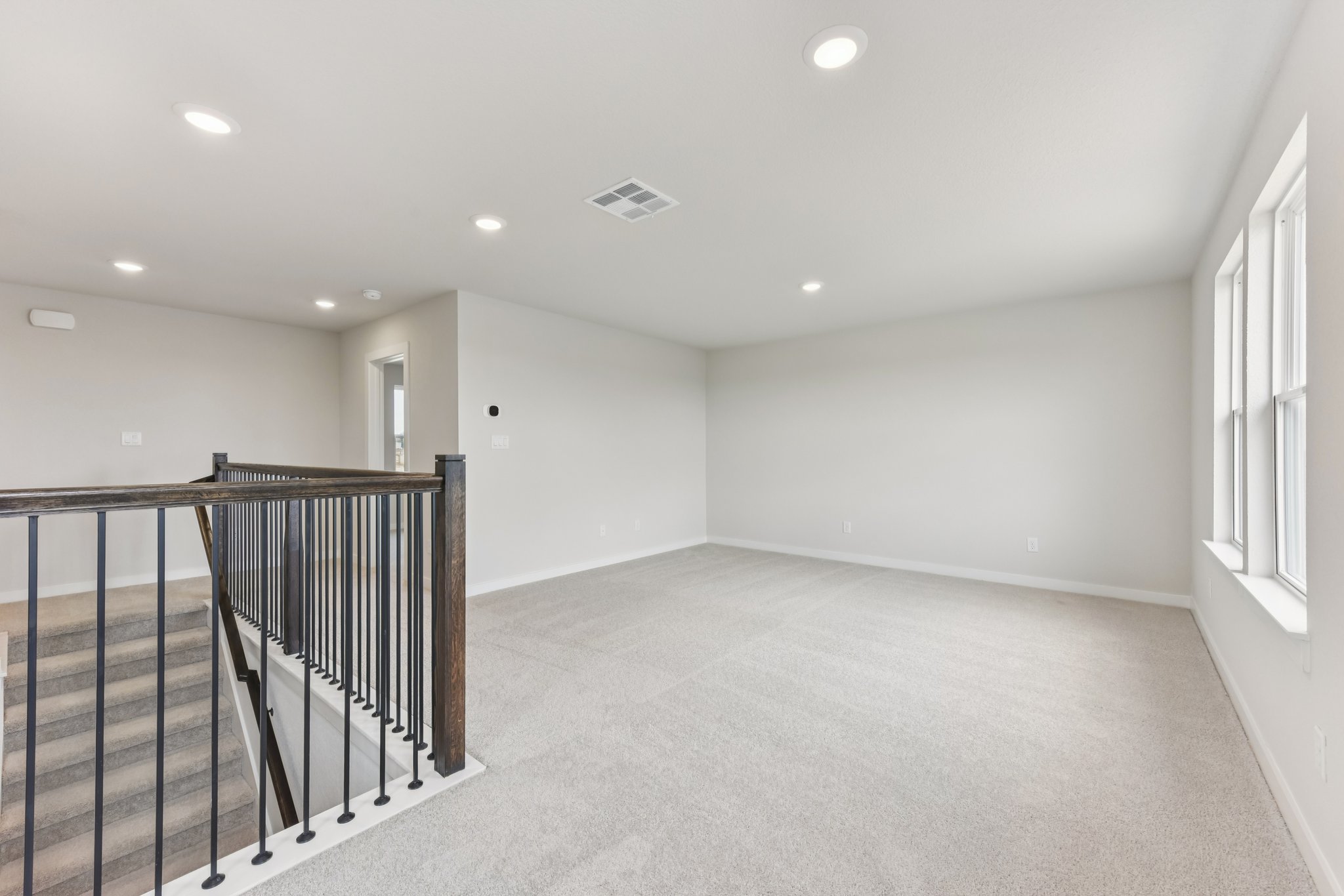 A room with a railing and a railing.