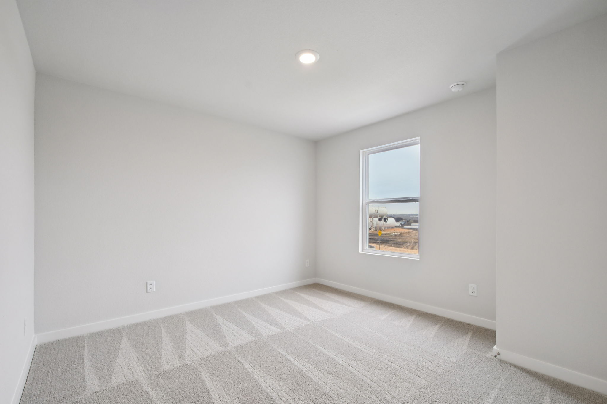 A room with a tile floor and a window.