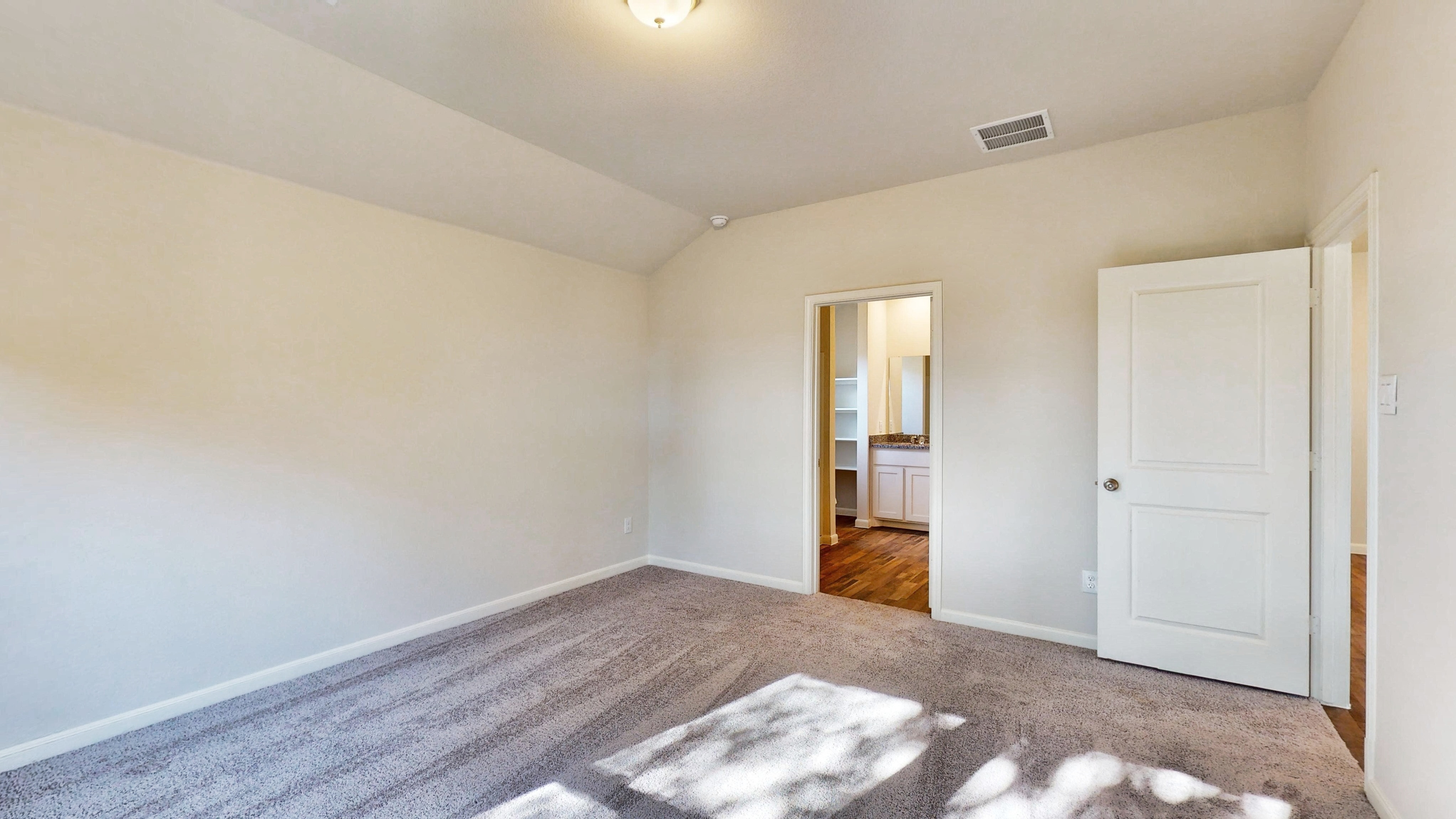 A hallway with white doors.