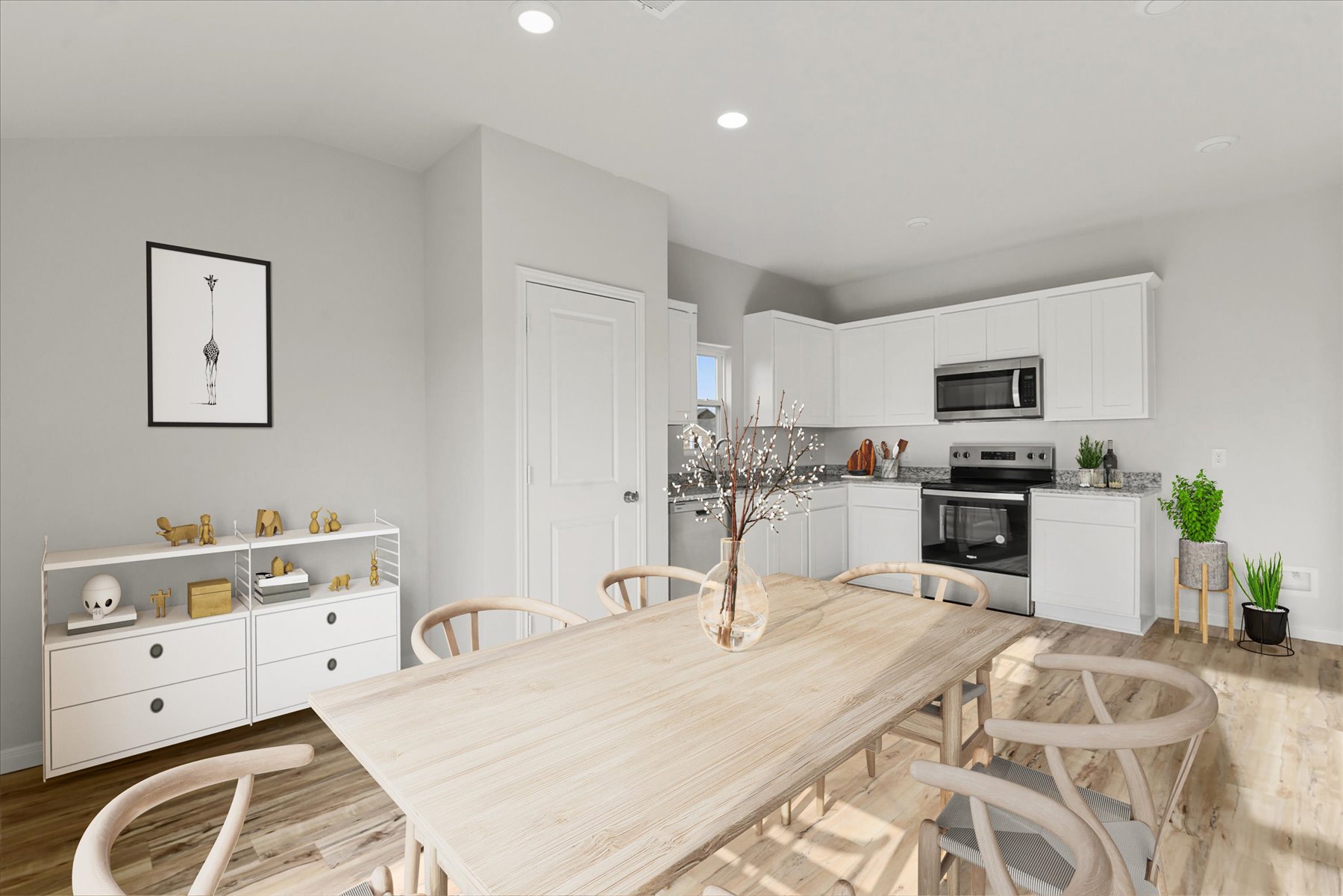 A kitchen with a dining table.