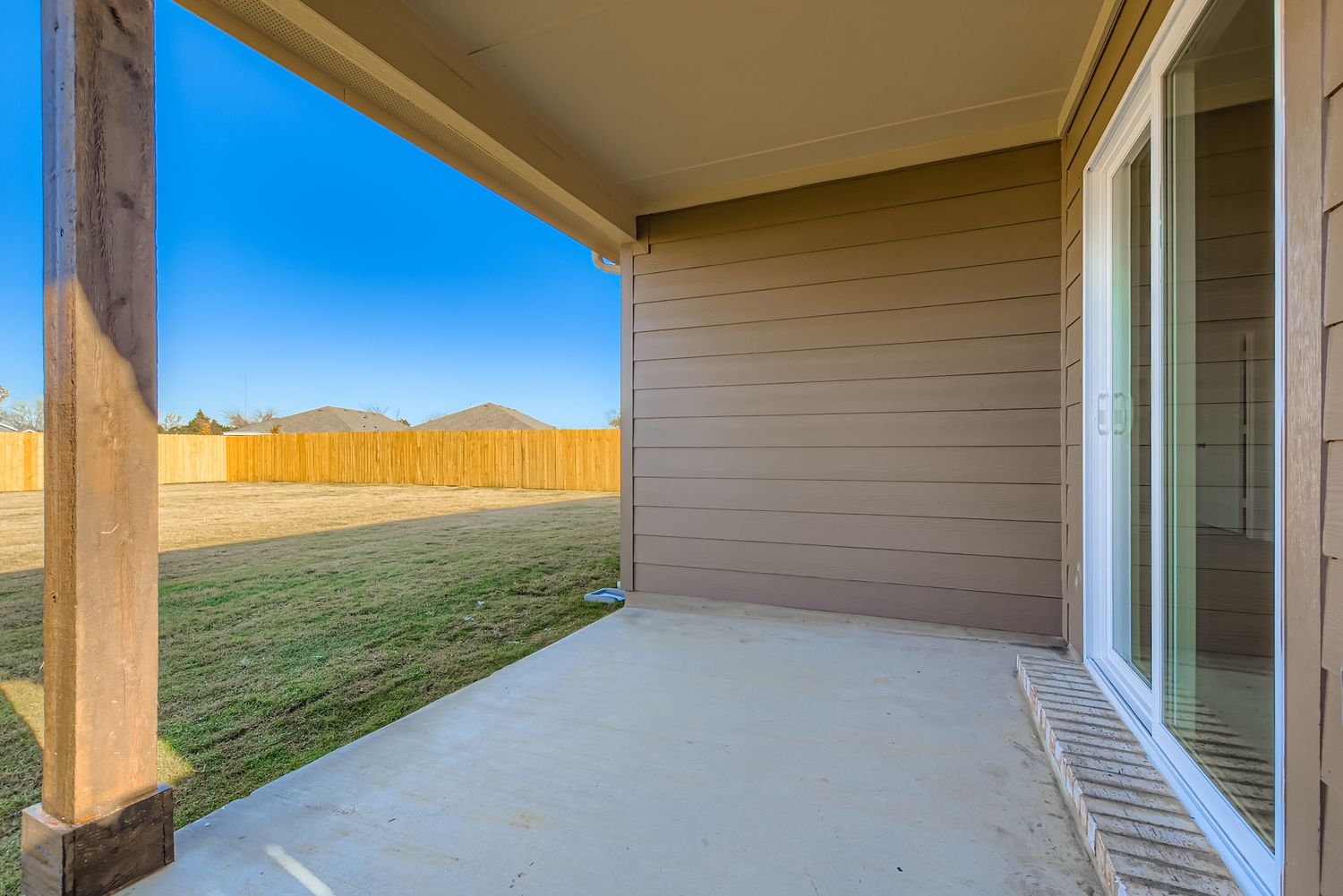 A house with a grass yard.