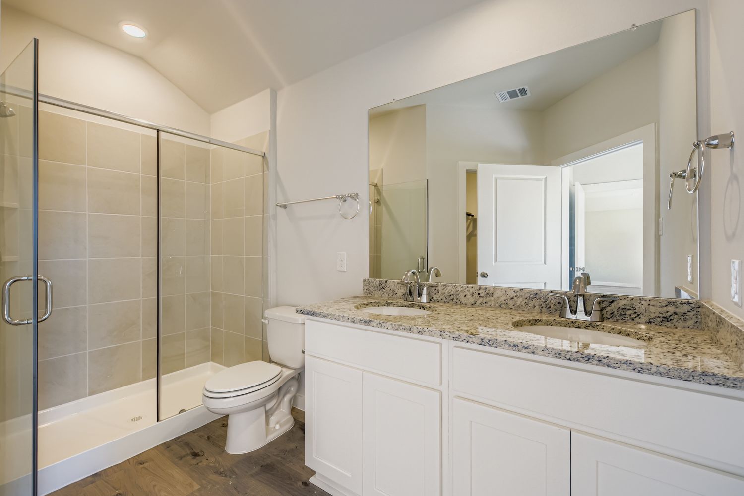A bathroom with a marble countertop.