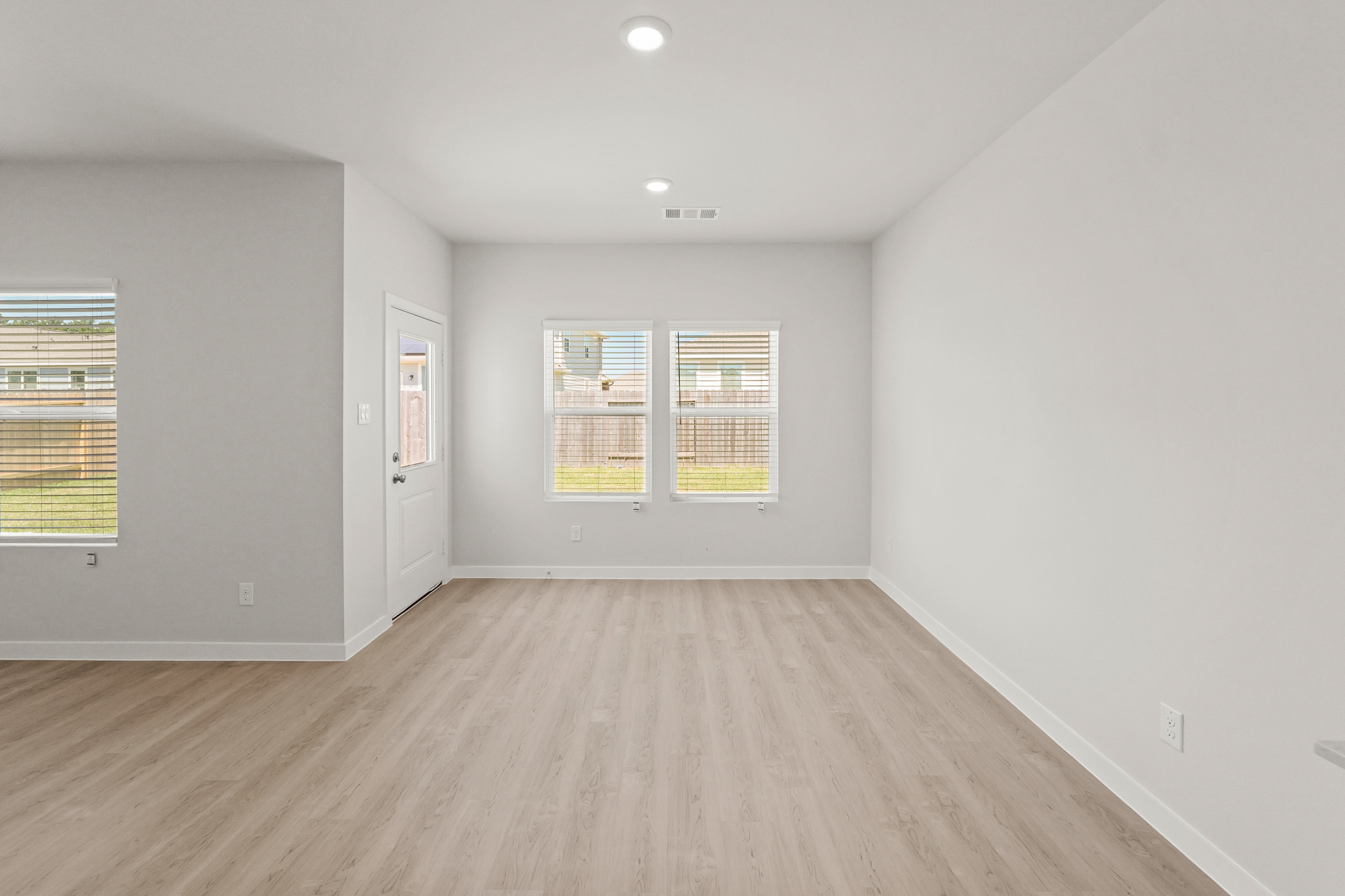 A room with a wood floor and a wood floor.