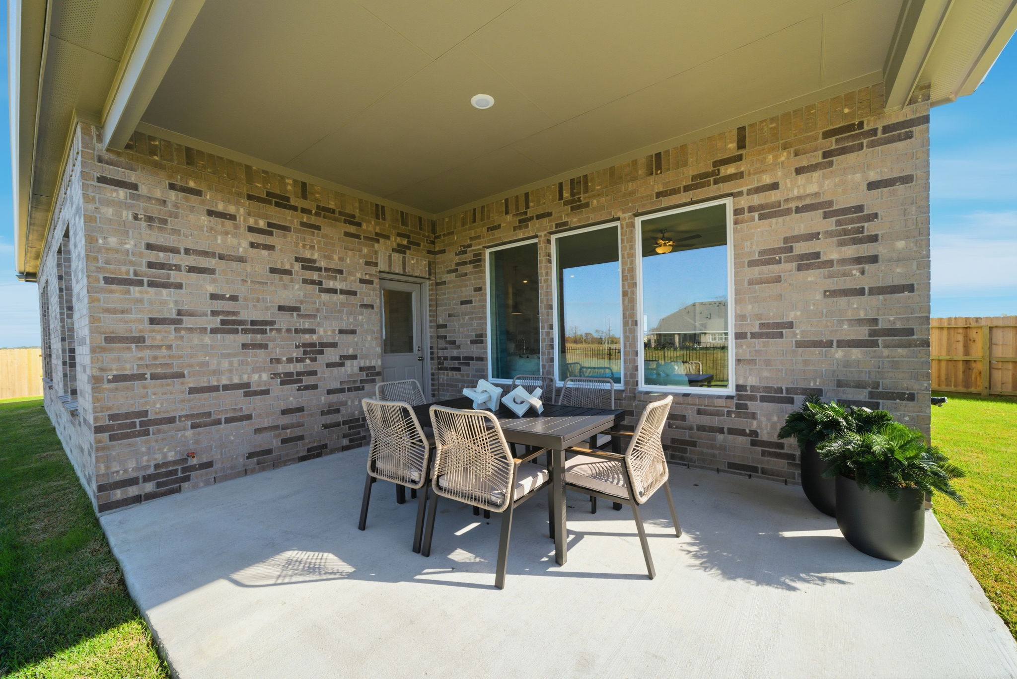 A patio with a table and chairs.
