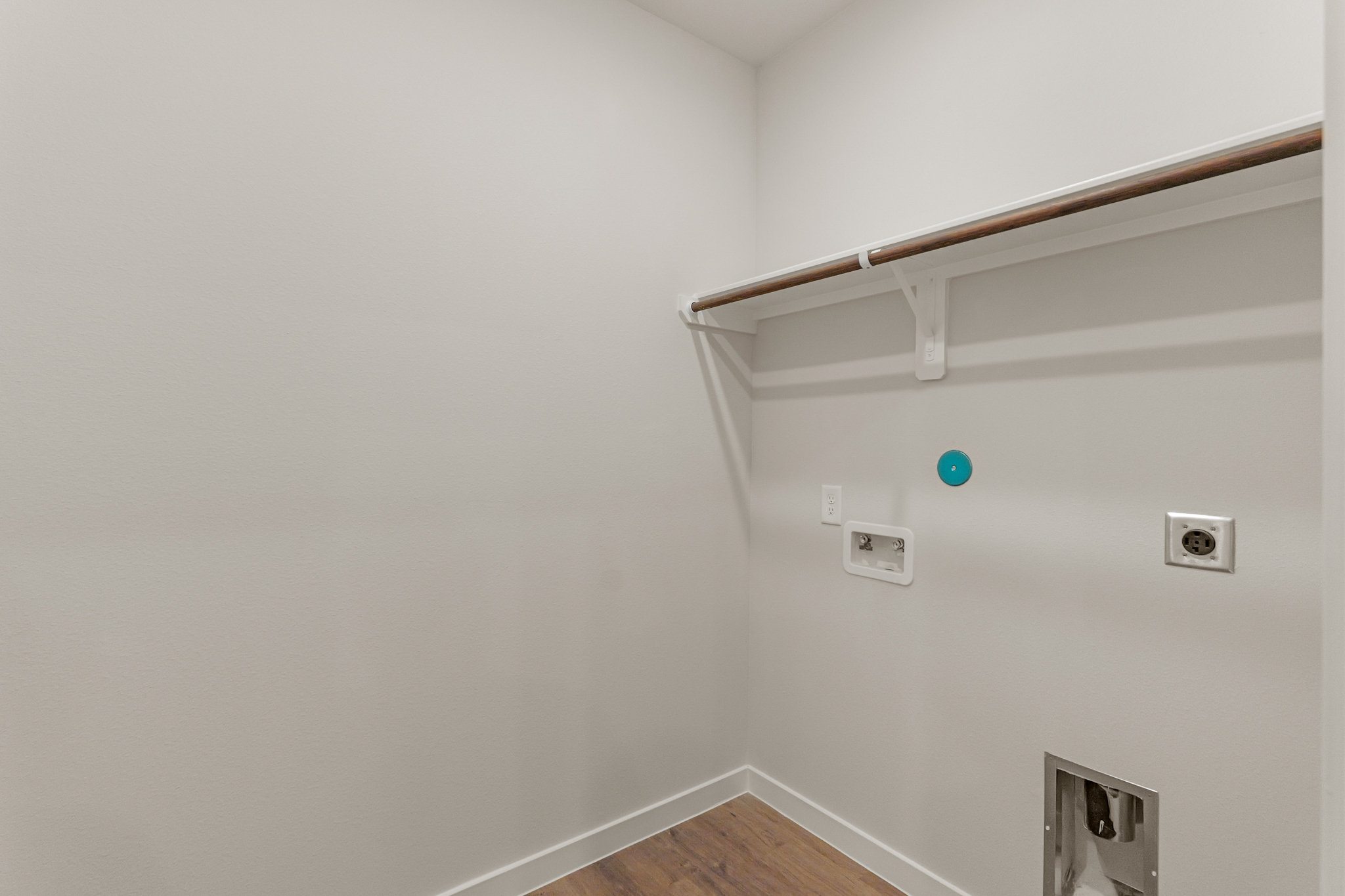 A white wall with a light on it.