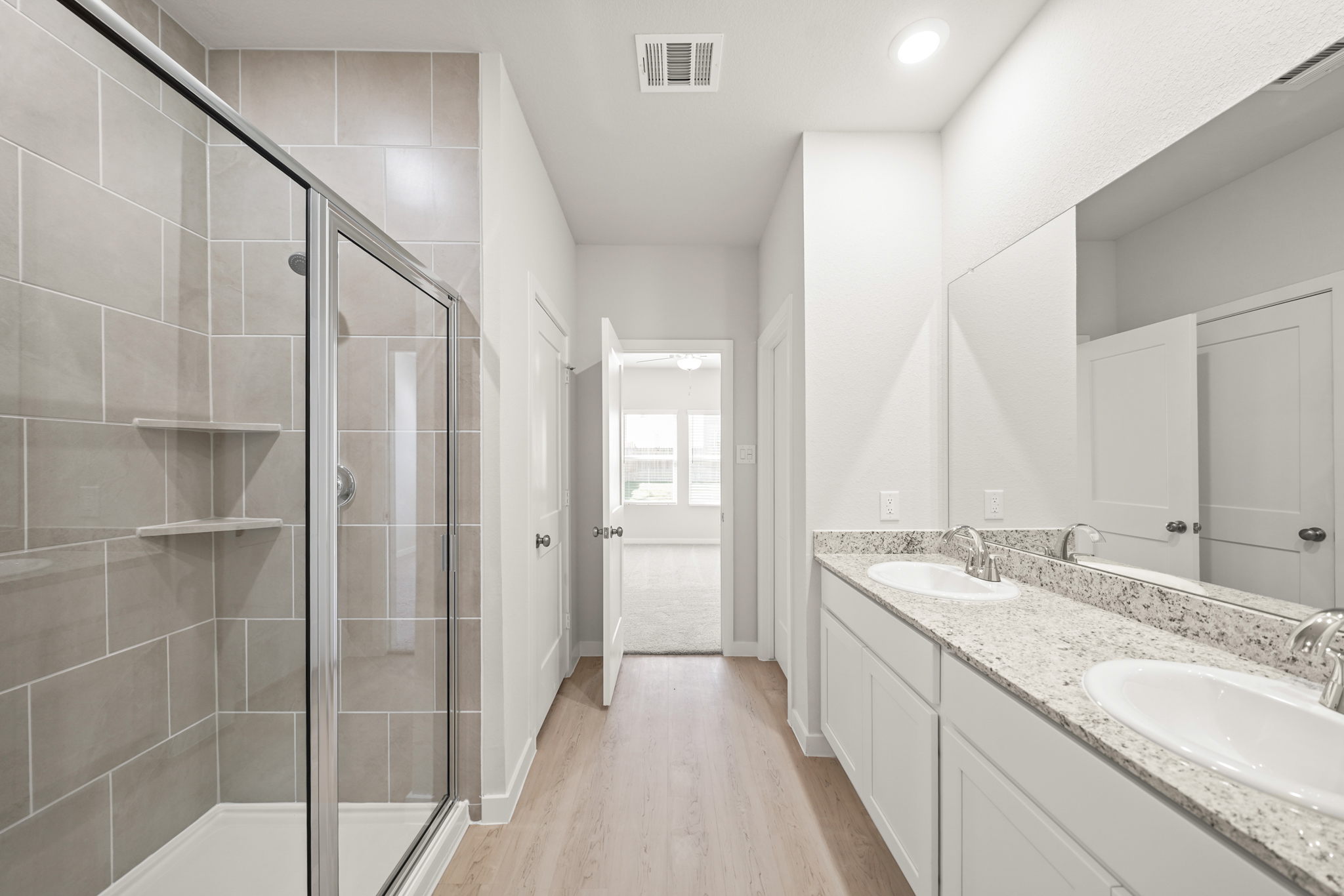 A bathroom with a glass shower.