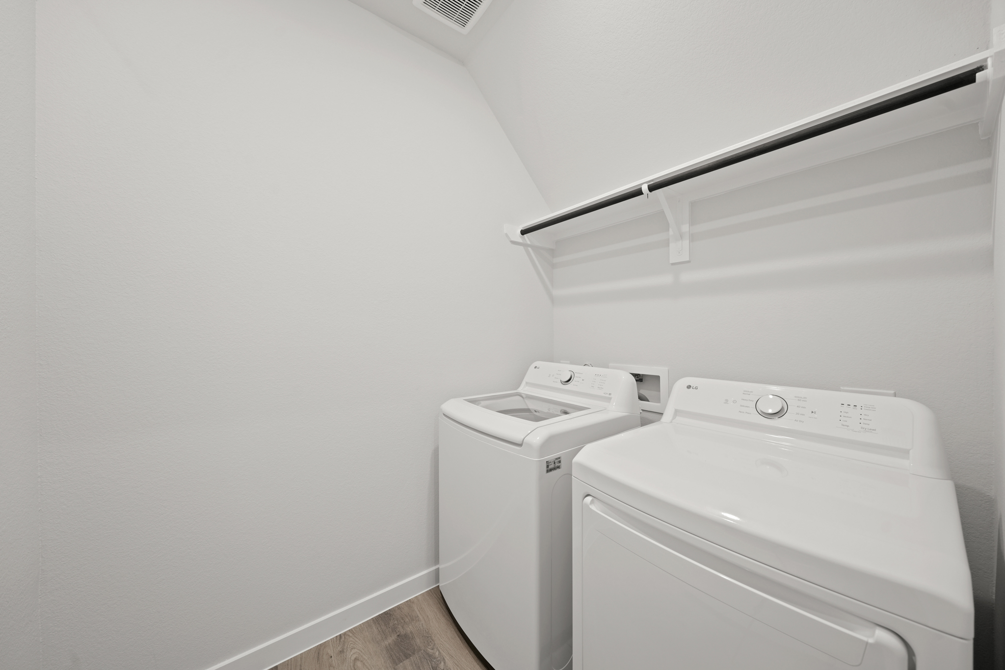 A washing machine in a room.